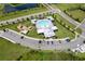 Aerial view of the community pool and playground on a sunny day at 10744 Hawks Landing Dr, Land O Lakes, FL 34638