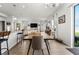 Dining area with table, chairs, and natural light, seamlessly connected to the living space at 10744 Hawks Landing Dr, Land O Lakes, FL 34638