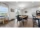 Bright dining space with stylish table and chairs, connecting the kitchen and living areas at 10744 Hawks Landing Dr, Land O Lakes, FL 34638