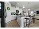 Modern kitchen boasts granite island, pendant lighting, stainless appliances, and bar seating at 10744 Hawks Landing Dr, Land O Lakes, FL 34638