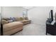 Comfortable carpeted living room with a plush sectional and window at 10744 Hawks Landing Dr, Land O Lakes, FL 34638