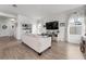 Bright living room with wood floors, large windows, and a decorative built in at 10744 Hawks Landing Dr, Land O Lakes, FL 34638