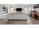 Spacious living room featuring wood floors, a built in, and entertainment center at 10744 Hawks Landing Dr, Land O Lakes, FL 34638
