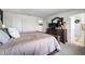 Tranquil main bedroom featuring a large bed, dresser and a mirror at 10744 Hawks Landing Dr, Land O Lakes, FL 34638
