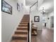 Bright foyer with staircase, hardwood floors, and decorative accents at 10744 Hawks Landing Dr, Land O Lakes, FL 34638