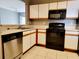 Kitchen with stainless steel appliances and light wood cabinets at 6410 Cypressdale Dr # 201, Riverview, FL 33578