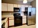 Kitchen with stainless steel appliances and light wood cabinets at 6410 Cypressdale Dr # 201, Riverview, FL 33578
