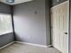 Gray bedroom with window and closet at 6410 Cypressdale Dr # 201, Riverview, FL 33578