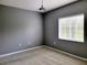 Gray-walled bedroom with window and carpet at 6410 Cypressdale Dr # 201, Riverview, FL 33578