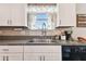 Kitchen sink and countertop with stainless steel appliances at 3172 Lytton Hall Dr, Zephyrhills, FL 33540