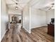 Wood-look floors and neutral walls in a bright hallway at 3172 Lytton Hall Dr, Zephyrhills, FL 33540