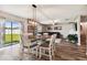 Open dining room with view of the backyard and living room at 3172 Lytton Hall Dr, Zephyrhills, FL 33540