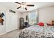 Bedroom with ceiling fan, window, and double door closet at 3172 Lytton Hall Dr, Zephyrhills, FL 33540