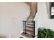 Modern staircase with a safety gate at 3172 Lytton Hall Dr, Zephyrhills, FL 33540