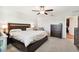 Spacious bedroom with king-size bed, ceiling fan and dresser at 3172 Lytton Hall Dr, Zephyrhills, FL 33540