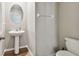 Clean powder room with pedestal sink and toilet at 3172 Lytton Hall Dr, Zephyrhills, FL 33540