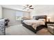 Spacious bedroom with king-size bed, ceiling fan, and ample natural light at 3172 Lytton Hall Dr, Zephyrhills, FL 33540