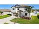 Two-story house with gray siding, gray shutters, and a landscaped front yard at 3172 Lytton Hall Dr, Zephyrhills, FL 33540