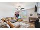 Spacious play room with two sofas and game table at 3172 Lytton Hall Dr, Zephyrhills, FL 33540