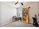 Bedroom with ceiling fan, window and bookshelf at 3172 Lytton Hall Dr, Zephyrhills, FL 33540