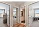 Hallway with wood floors and access to bedrooms and bathroom at 3172 Lytton Hall Dr, Zephyrhills, FL 33540
