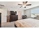 Spacious bedroom with king-size bed, ceiling fan and dresser at 3172 Lytton Hall Dr, Zephyrhills, FL 33540