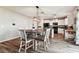 Dining area with a round table and access to the kitchen at 3172 Lytton Hall Dr, Zephyrhills, FL 33540