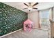 Charming bedroom with playful tent and patterned wall at 3172 Lytton Hall Dr, Zephyrhills, FL 33540