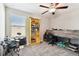 Bright bedroom with built-in bunk bed, desk, and shelving at 3172 Lytton Hall Dr, Zephyrhills, FL 33540