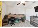 Bedroom with built-in bunk bed, dresser, and gaming setup at 3172 Lytton Hall Dr, Zephyrhills, FL 33540