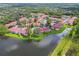 Aerial view of a large condo community with lakefront property at 9481 Highland Oak Dr # 1615, Tampa, FL 33647
