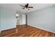 Light and airy bedroom featuring wood-look floors at 9481 Highland Oak Dr # 1615, Tampa, FL 33647