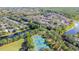Aerial view of tennis courts and surrounding community at 9481 Highland Oak Dr # 1615, Tampa, FL 33647