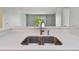 Modern kitchen sink and faucet with white quartz countertops at 9481 Highland Oak Dr # 1615, Tampa, FL 33647