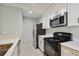 Updated kitchen featuring stainless steel appliances and white shaker cabinets at 9481 Highland Oak Dr # 1615, Tampa, FL 33647
