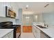 Bright kitchen boasts stainless steel appliances and an open layout at 9481 Highland Oak Dr # 1615, Tampa, FL 33647