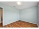 Bedroom with wood-look flooring and access to bathroom at 9481 Highland Oak Dr # 1615, Tampa, FL 33647