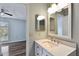 Updated bathroom with modern vanity and a large mirror at 9481 Highland Oak Dr # 1615, Tampa, FL 33647