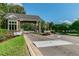 Gated community entrance with stone details at 9481 Highland Oak Dr # 1615, Tampa, FL 33647