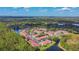 Aerial view of community with lake, lush trees, and multiple residential buildings at 9481 Highland Oak Dr # 1615, Tampa, FL 33647