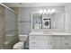 Updated bathroom with white vanity and walk-in shower at 9481 Highland Oak Dr # 1615, Tampa, FL 33647