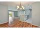 Open concept dining area with wood flooring and access to living room at 9481 Highland Oak Dr # 1615, Tampa, FL 33647