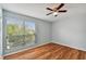 Light and airy bedroom with large window and wood-look floors at 9481 Highland Oak Dr # 1615, Tampa, FL 33647