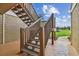 Wooden staircase leading to condo with scenic backyard view at 9481 Highland Oak Dr # 1615, Tampa, FL 33647