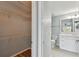 Bathroom with white vanity, toilet and access to closet at 9481 Highland Oak Dr # 1615, Tampa, FL 33647
