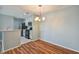 Bright dining area with wood flooring and modern chandelier at 9481 Highland Oak Dr # 1615, Tampa, FL 33647