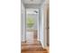 Hallway with wood-look flooring leading to bedrooms at 9481 Highland Oak Dr # 1615, Tampa, FL 33647