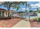 Community pool with picnic tables and gated entrance at 9481 Highland Oak Dr # 1615, Tampa, FL 33647