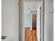 Hallway view of bedroom with wood-look floors and closet at 9481 Highland Oak Dr # 1615, Tampa, FL 33647