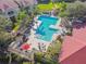 Lush landscaping surrounds this community pool and patio area at 9481 Highland Oak Dr # 1615, Tampa, FL 33647